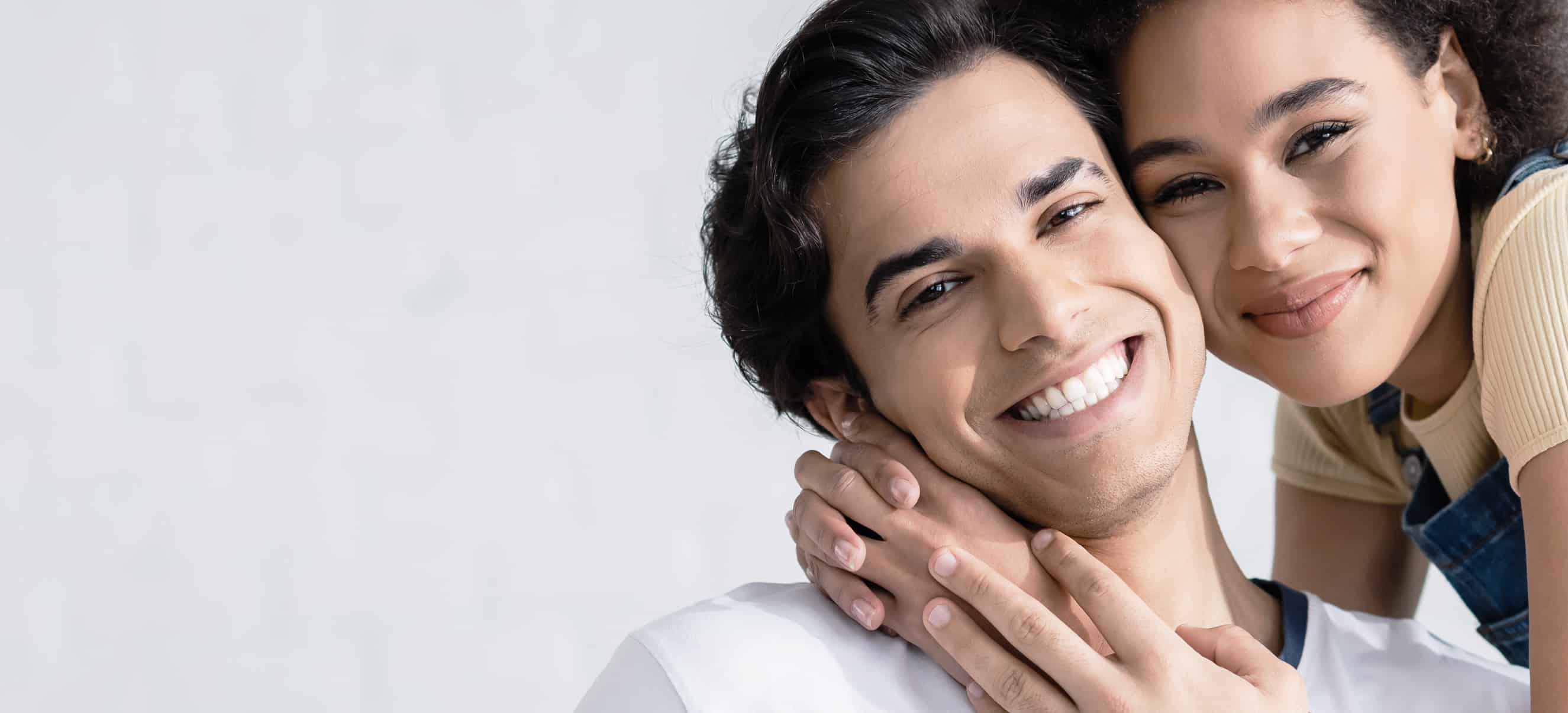 Man and woman smiling after the dentist in OKC