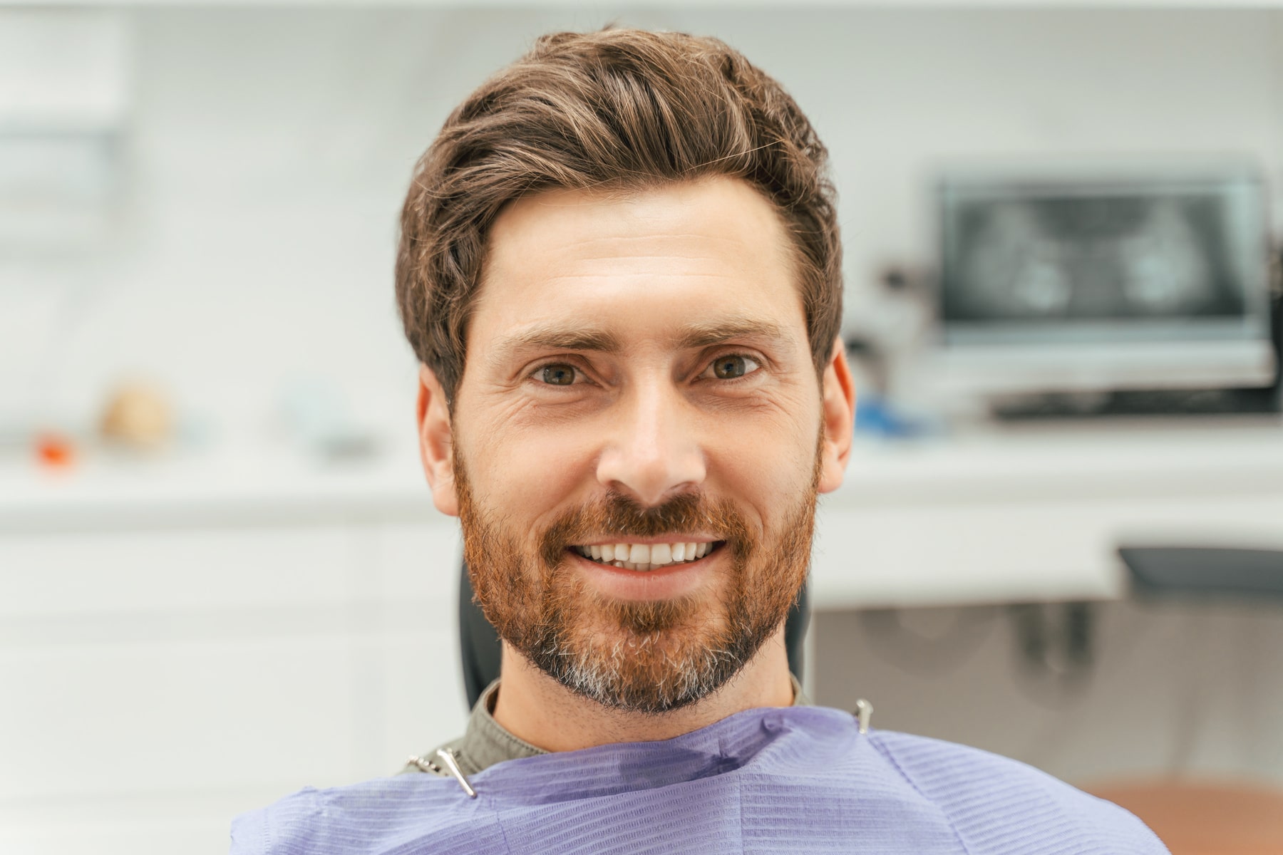 patient smiling after his dental extraction from Present Dental in Oklahoma City OK